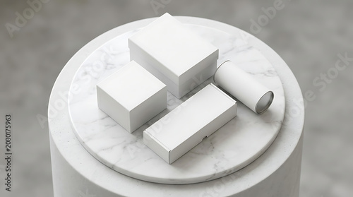 Set of blank white boxes and cylindrical tube container on a circular marble podium for luxury product branding mockup