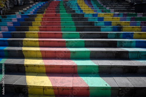 Neat arrangement of vibrant colorful stairs for background