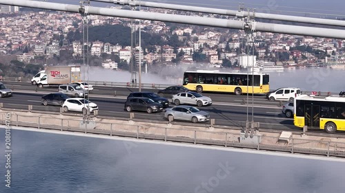 Aerial view of the Bosphorus bridges shrouded in fog; a postcard-worthy foggy scene in Istanbul.