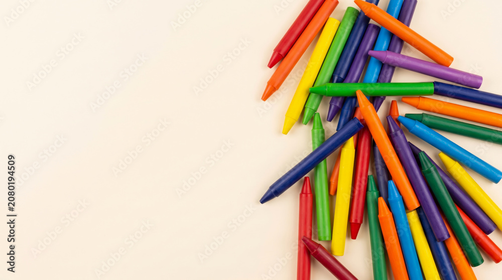 Fototapeta premium Colorful crayon, school, border, back to school supplies concept, playful art education background space. Education learning children student. colourful stationery supply, background banner frame