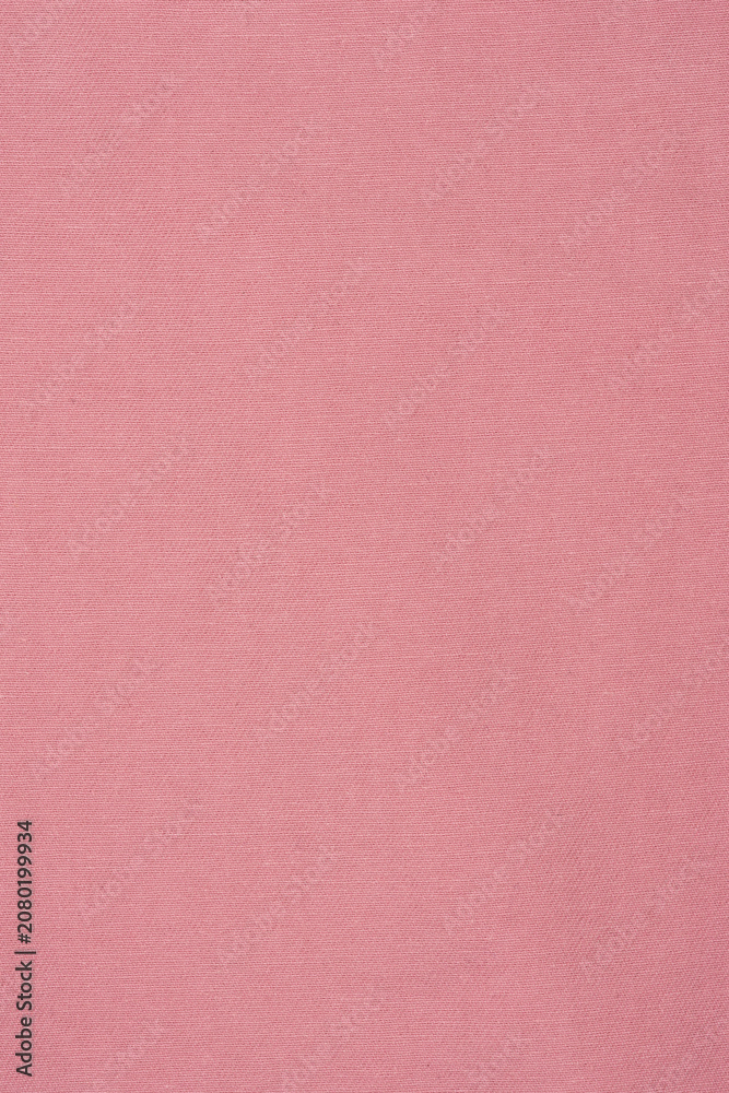 Fototapeta premium Pink textured fabric background with fine horizontal weave pattern