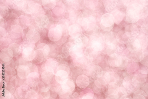 Light pink soft bokeh background with pale glowing circles