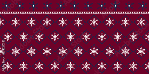 Fabric snowflake pattern on red background.