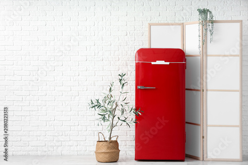 Red retro fridge with foldi...