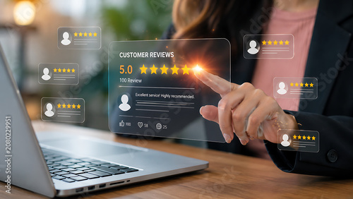 Person's finger touching glowing five star customer reviews on a digital interface during online evaluation