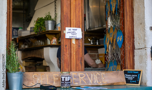 Traditional Seafood Restaurant Window in Piran Slovenia with Authentic Local Atmosphere and Mediterranean Culinary Culture