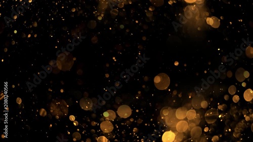 Slow Motion Shimmer Gold Bokeh Particles Drifting Dark Screen, Warm Golden Glowing Circles Holiday VFX Footage