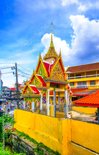 Golden Buddhist Wat Suwankeereewong Temple panorama blue sky in Thailand.