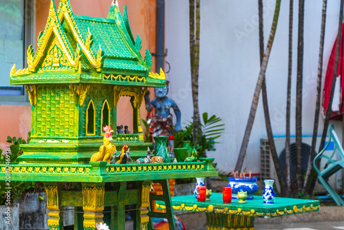 Golden green and yellow Thai spirit ghost house in Thailand.