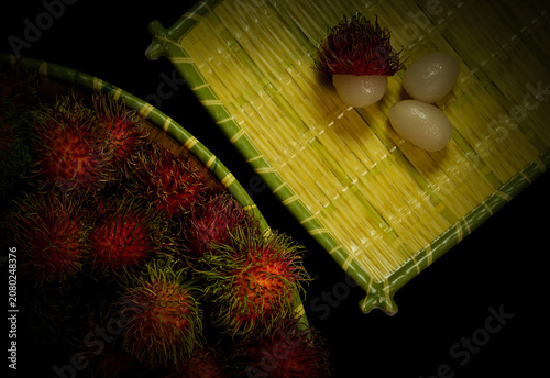 Fotografie Rambutans organic fruit with hairy alien looking fruit, with a creamy taste and