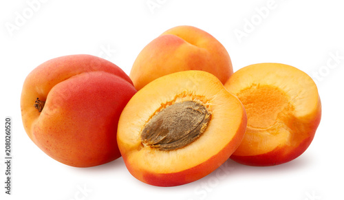 Foto Ripe apricots and halves on a white background. Isolated