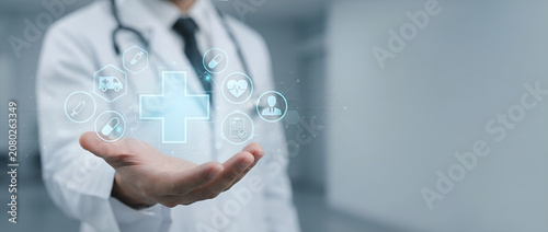 Doctor interacting with a futuristic medical digital interface with healthcare icons