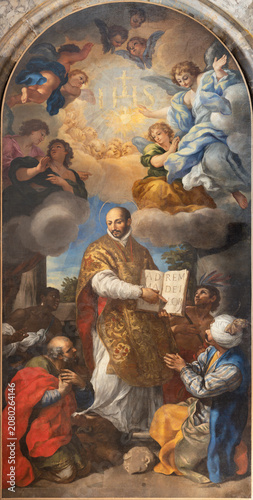 LUCCA, ITALY - JUNE 23, 2026: The painting of St. Ignatius of Loyola defeating heresy in the church Chiesa dei Santi Giovanni e Reparata by Pietro Locateli (1690 - 1699)