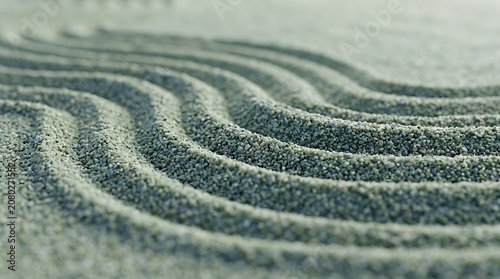 Close up of raked sand with wavy patterns in a zen garden