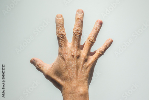 Fotografie Hands of senior people on white background. Health care concept.