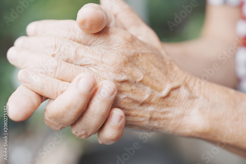 Canvas Print A close-up shot focuses on the weathered, wrinkled hands of an elderly person gently clasping each other