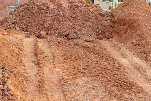 Soil dirt pile track construction excavation ground with tire mark at work site