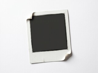 A blank retro square photograph frame with curled corners isolated on a clean white background for your creative design mockup