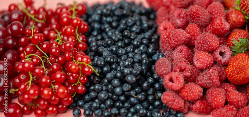 Mix of different ripe tasty berries as background