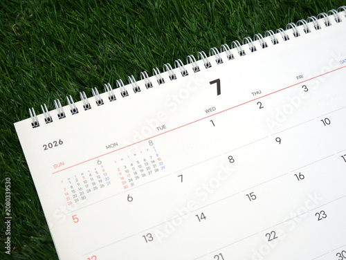 2026 calendar, July 2026 desk calendar placed on the lawn, 2026 New Year's resolutions.