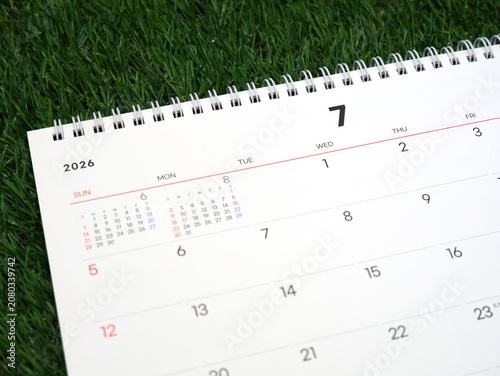 2026 calendar, July 2026 desk calendar placed on the lawn, 2026 New Year's resolutions.