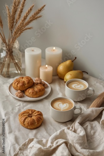 Morning Coffee and Snacks Set on a Table With Candles and Decorative Items