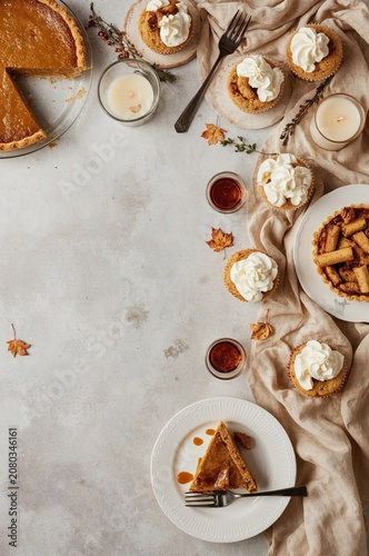 Delicious Dessert Table With Pies, Tarts, and Whipped Cream for a Gathering i...