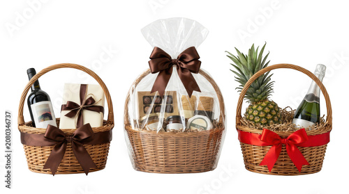 Three gift baskets with wine, champagne, pineapple, chocolates and snacks isolated on transparent background