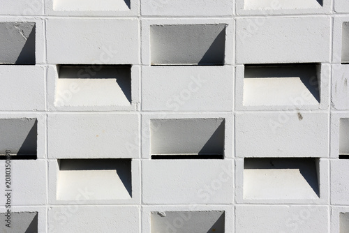 Photos Full frame background texture of a white architectural breeze block wall casting