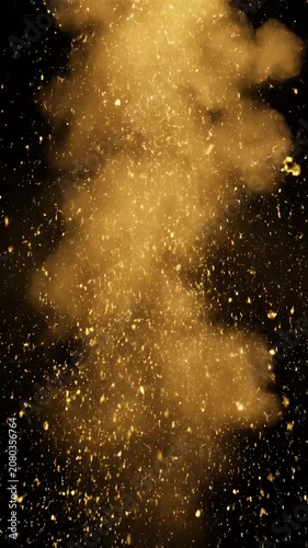 Golden spark explosion with smoke on black background.