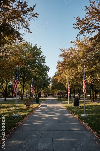 Pathway Lined With Flags in a Park During Fall With Colorful Leaves in the Trees
