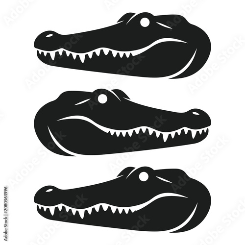 Three black silhouette alligator heads with sharp teeth profiles side view  reptiles icon