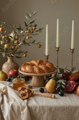 Gathering of Fruits and Bread on a Table With Candles and Decorative Elements...