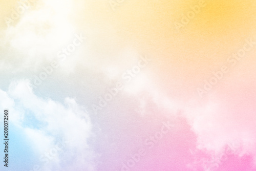 fantasy blurred cloudy sky with yellow , blue and pink gradient color and grunge paper texture when zoom 100%,  nature abstract background