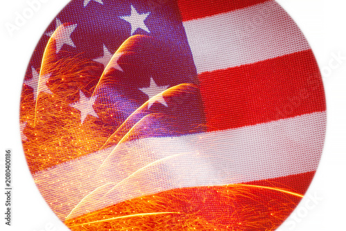 close up of circle with fireworks against waved United States flag