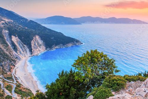 Kefalonia, Greece. Panoramic view over Myrtos beach, Assos at sunset.