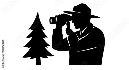 Wildlife observer watching from near a tree silhouette