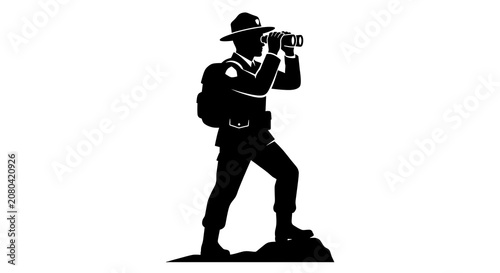 Hiker with backpack using binoculars on rocky terrain silhouette