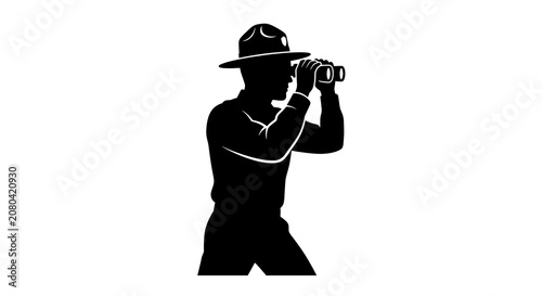 Focused ranger observing through binoculars silhouette
