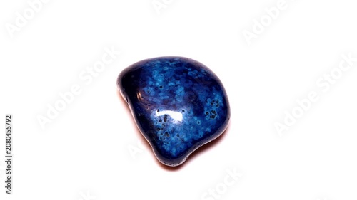Quartz chalcedony orbicular blue agate tumbled stone isolated white background