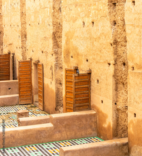 Historic Moorish Palace Ruins with Traditional Mosaic Tiles and Wooden Doors in Marrakech