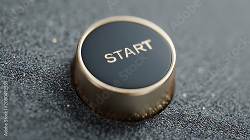 Start button on a black surface ready for use in an electronic device