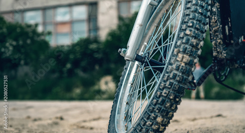 Bottom view of wheel and tire of electric bike. Sturdy details, sophisticated style, reliability, energy.