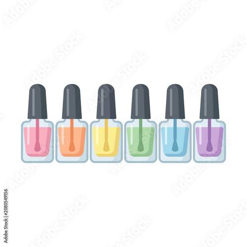 Colorful nail polish bottles in row.