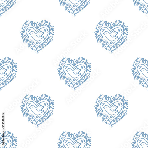 Blue openwork lacy heart patches with bird. Seamless pattern of hand drawing element and ornamental details. Print for fabric, wallpaper or wrapping paper