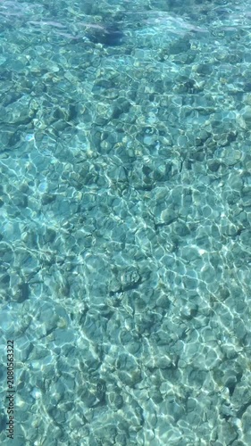 girl swims in the clear sea of ​​Salento