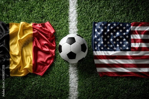 Dramatic Top View of Soccer Ball Between Belgium and USA Flags on Turf