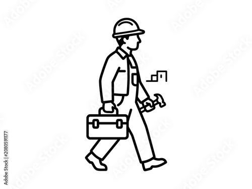 Worker walks while carrying tools and a toolbox