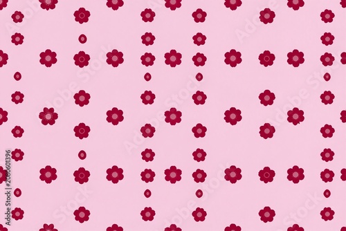 A pink background with a repeating pattern of flowers