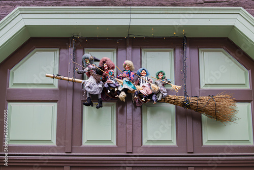 Witch dolls on a broomstick made of twigs
